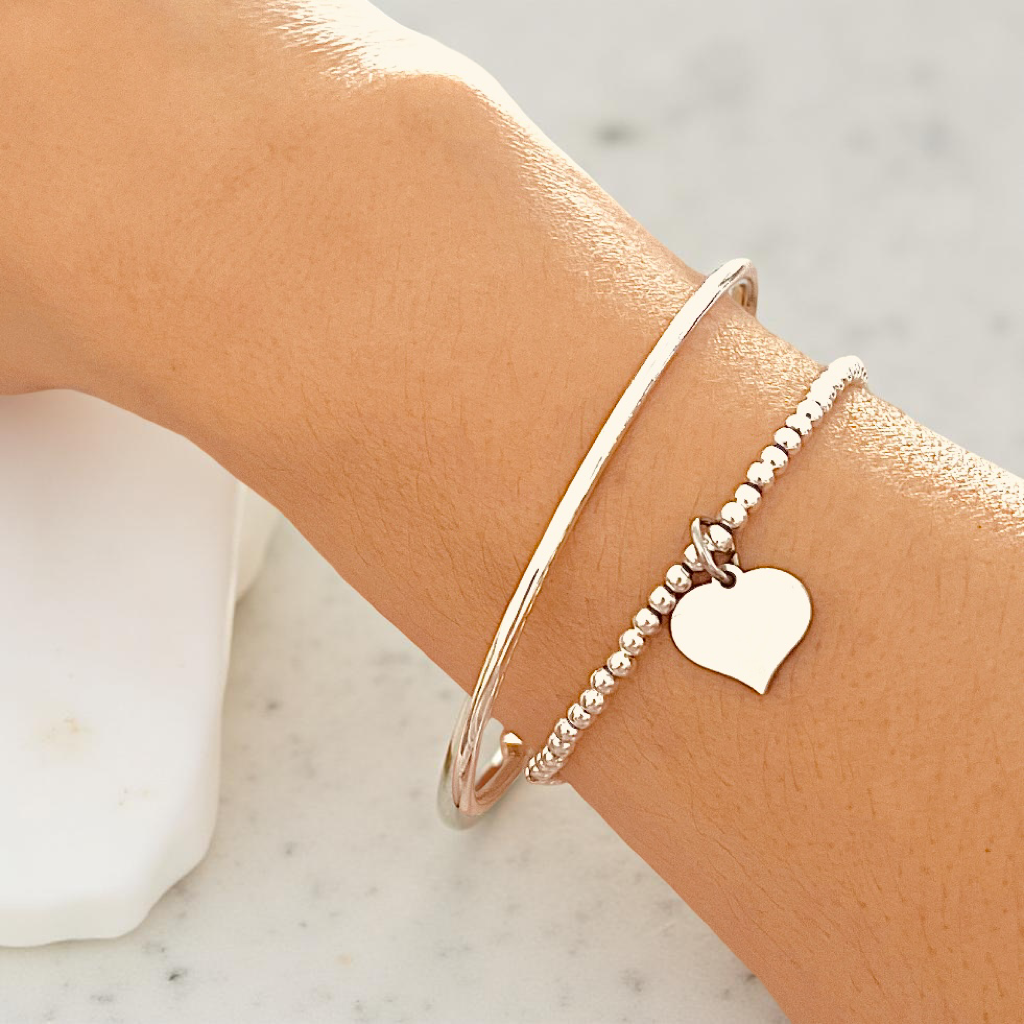 Silver Beaded Stretch Bracelet Stack with Torque Open Bangle and Stretch Bracelet with Heart Charm