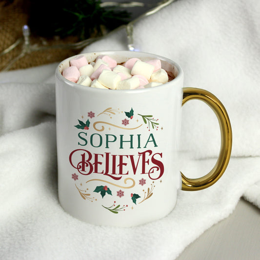 Personalised Believes In Christmas Gold Handled Mug Peach Bomb Fashion, Jewellery, Homeware & Gifts Mugs