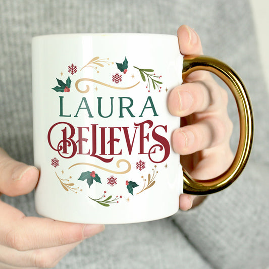 Personalised Believes In Christmas Gold Handled Mug Peach Bomb Fashion, Jewellery, Homeware & Gifts Mugs