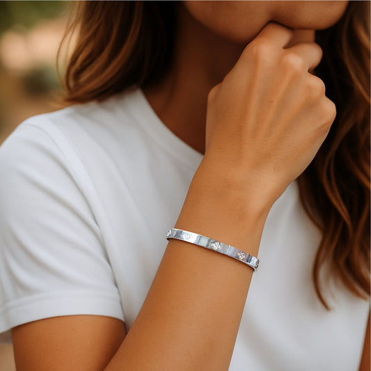 Silver Bangle with Clover Cubic Zirconia Details and “Love is All Around” Engraved Message