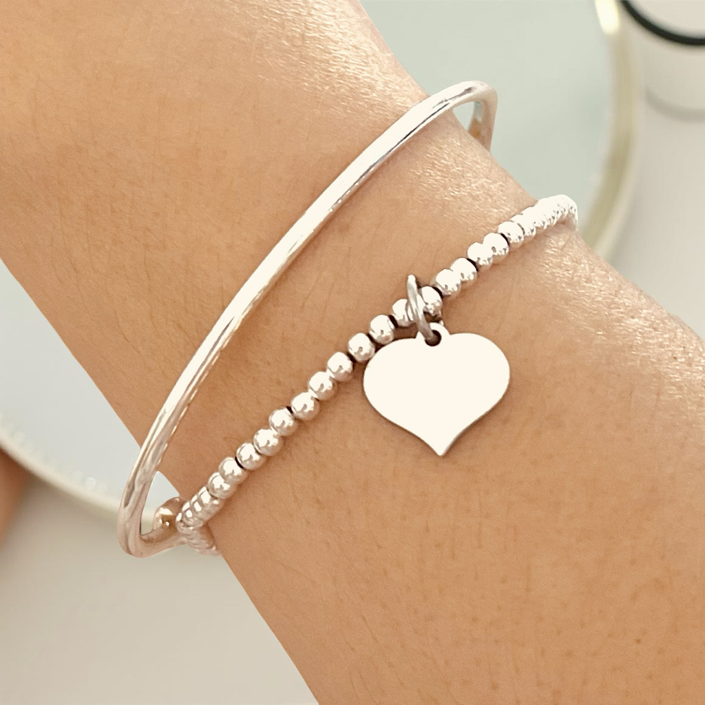 womens Silver bracelet with a heart charm elastic 