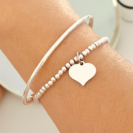 womens Silver bracelet with a heart charm elastic 