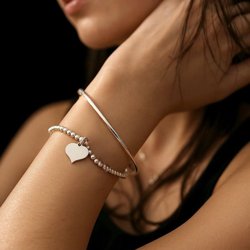 Silver Beaded Stretch Bracelet Stack with Torque Open Bangle and Stretch Bracelet with Heart Charm