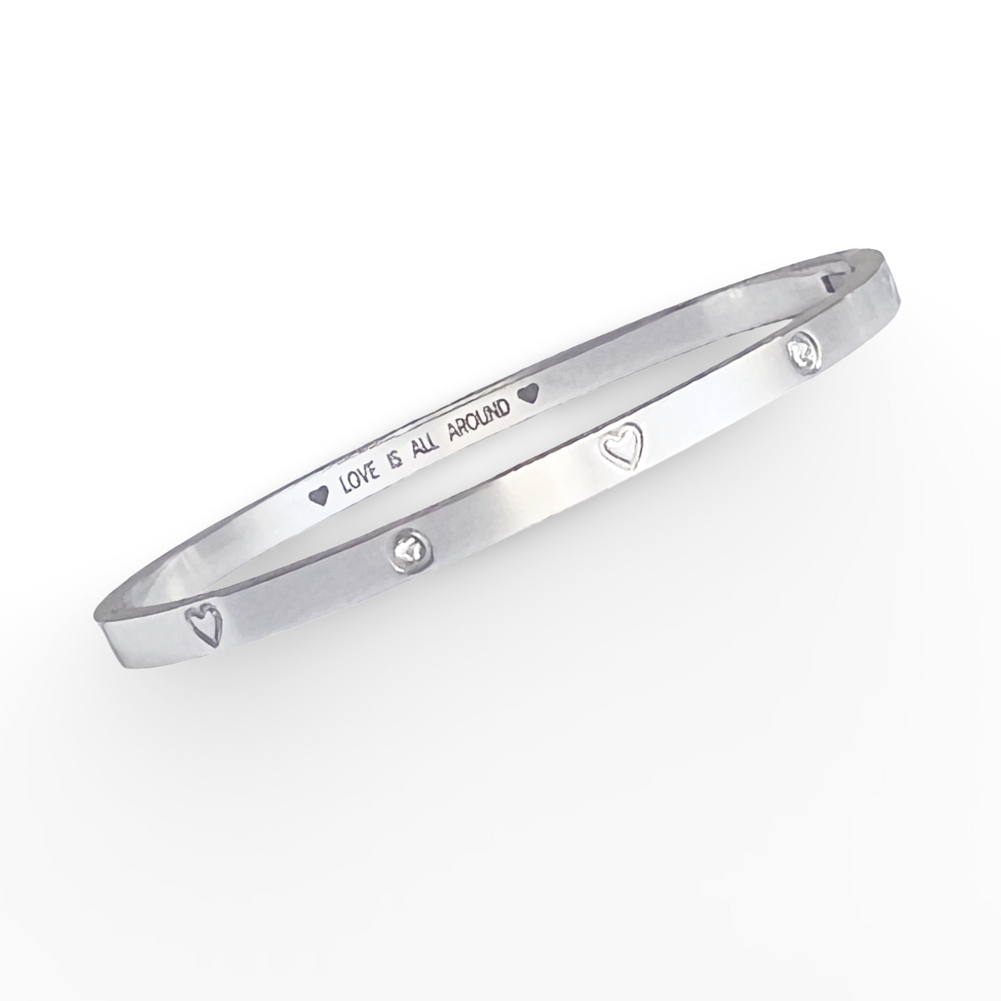 Silver bracelet with engraved text on a white background