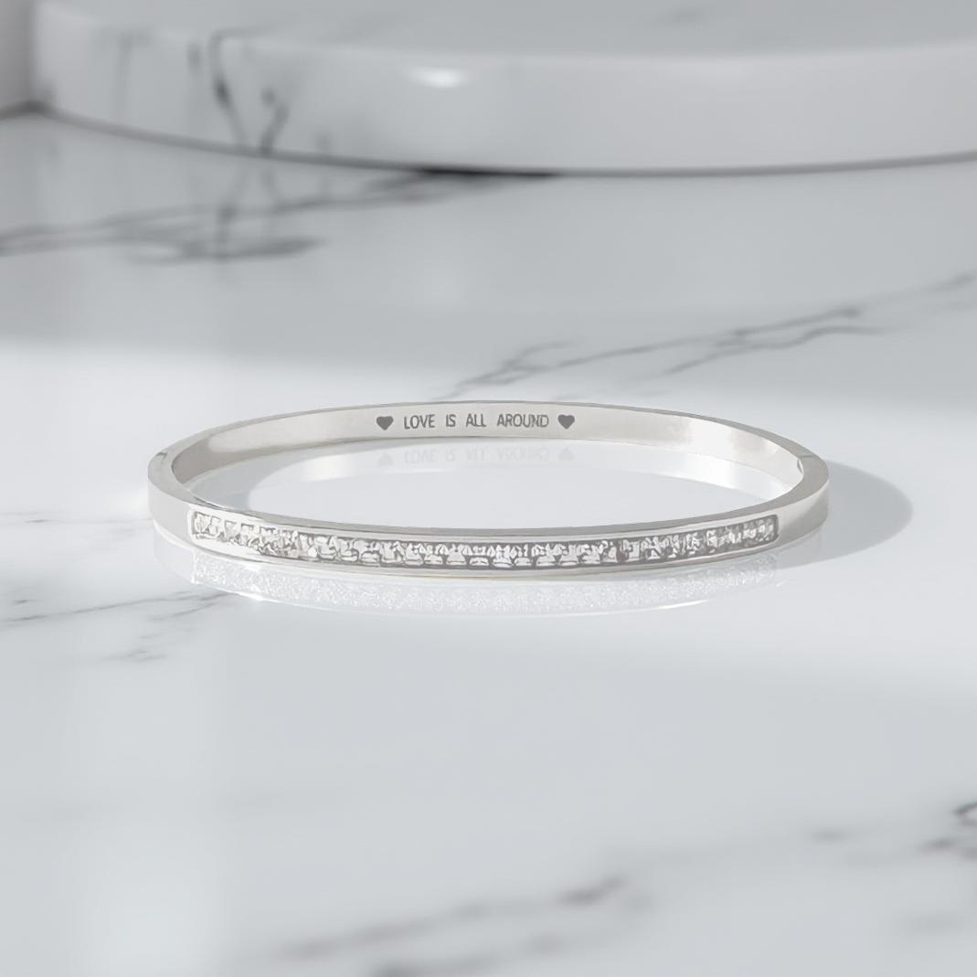 Silver Hinged Bangle with Sparkling Cubic Zirconia Band and "Love is All Around" Engraving