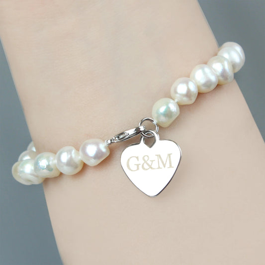 Pearl bracelet with a heart-shaped tag on a wrist against a neutral background
gift for her birthday, wedding, anniversary girlfriend mum sister auntie aunt wife charm bracelet personalised 