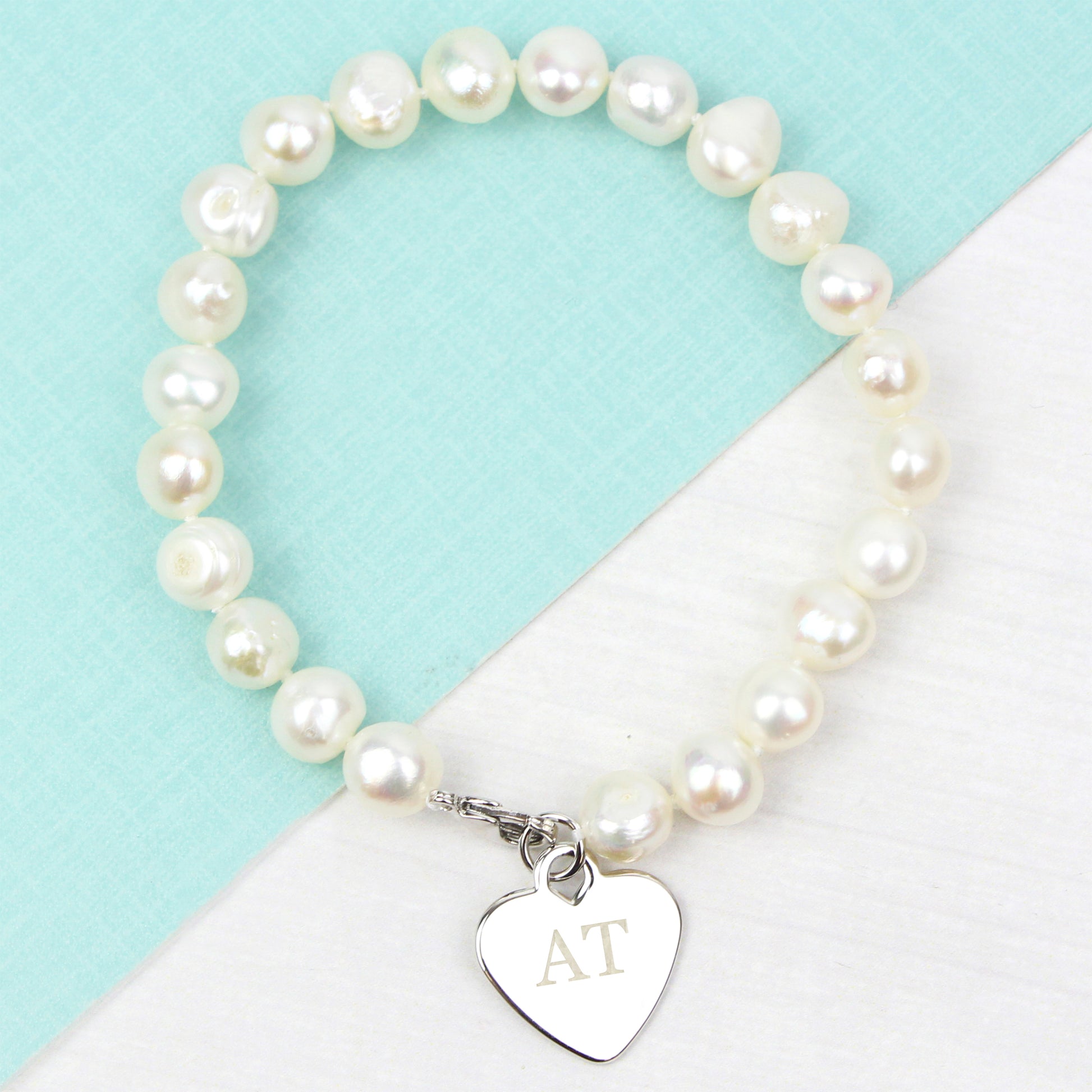 Pearl bracelet with a heart-shaped tag on a wrist against a neutral background
gift for her birthday, wedding, anniversary girlfriend mum sister auntie aunt wife charm bracelet personalised 