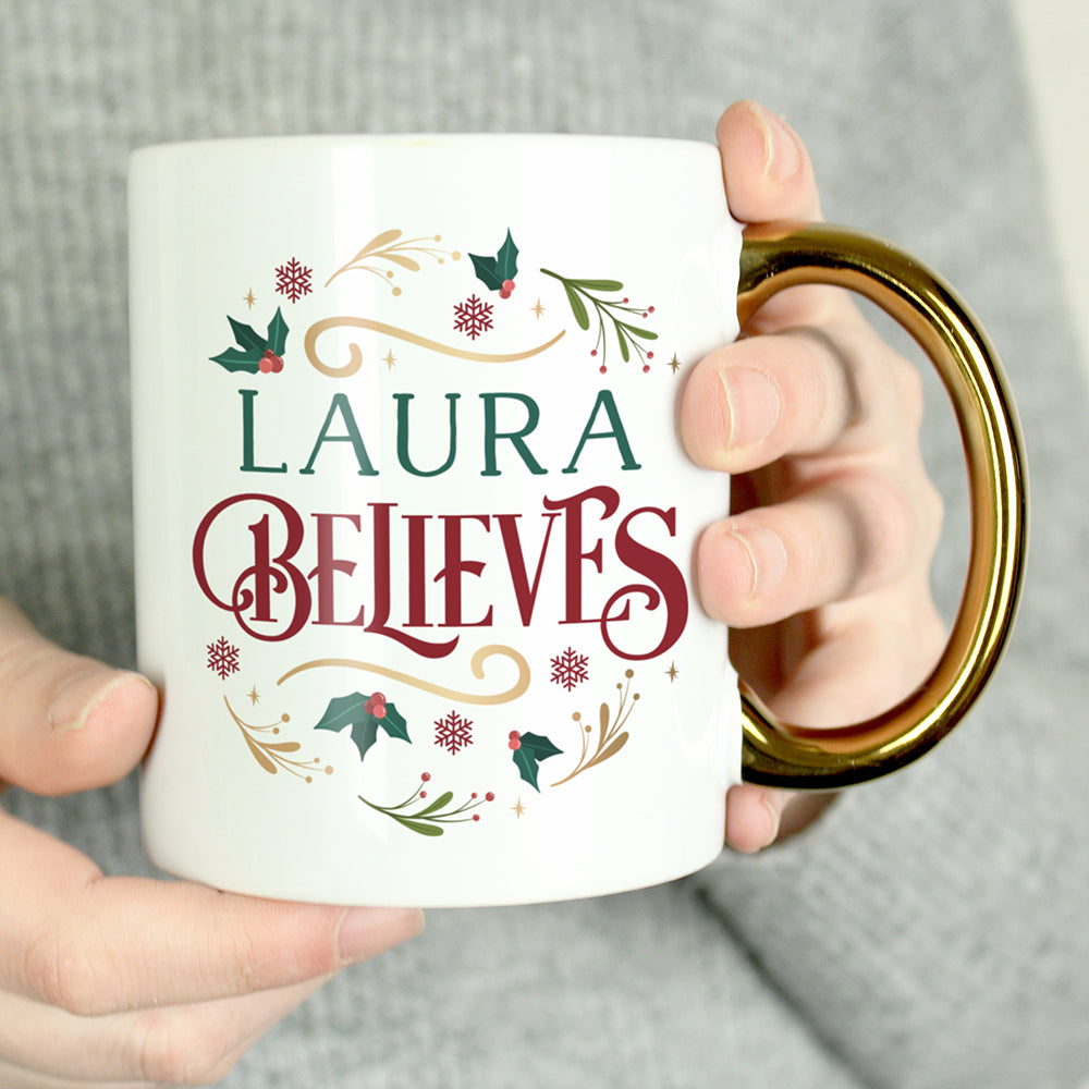 Personalised Believes In Christmas Gold Handled Mug Peach Bomb Fashion, Jewellery, Homeware & Gifts Mugs