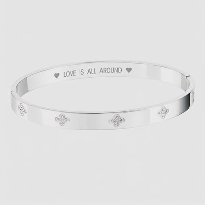 Silver Bangle with Clover Cubic Zirconia Details and "Love is All Around" Message