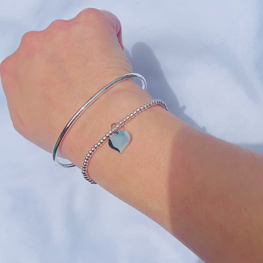 Silver Beaded Stretch Bracelet Stack with Torque Open Bangle and Stretch Bracelet with Heart Charm